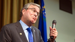 Former Florida Gov. Jeb Bush reacts to a question at the Mountain Shadows Community Center in Las Vegas Monday, March 2, 2015. Bush distanced himself from his family on Monday as he courted senior citizens in Nevada, the first stop in a national tour aimed at key states on the presidential primary calendar. (AP Photo/Las Vegas Sun, Steve Marcus)